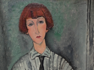 This image is a cropped photo of Modigliani's painting titled "Jeune Fille à la Chemise Rayée"(Young woman with striped shirt) executed in 1917. It depicts the portrait of a young woman with short red hair and bang wearing a striped shirt and a black tie. The background is in grey and turquoise tons.